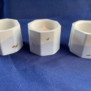 Handmade Jesmonite tealight holders in blue, cream and gold leaf