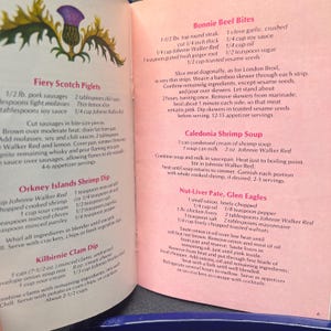 May include: Open cookbook page with recipes for Scottish dishes. Recipes include Fiery Scotch Piglets, Orkney Islands Shrimp Dip, and Bonnie Beef Bites. The page features text and a thistle illustration.