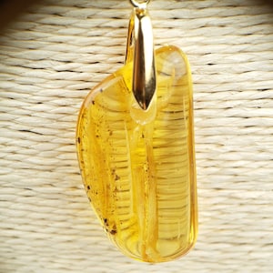 Baltic Amber pendant, adjustable black leather cord, gold bail