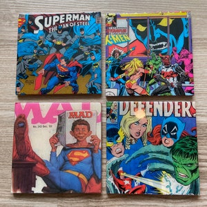 May include: Four vintage comic book covers featuring Superman, The Uncanny X-Men, Mad Magazine, and The Defenders. The Superman cover features Superman flying with a group of Batman characters. The X-Men cover features a large, menacing, blue-skinned creature with a sharp, pointed mouth. The Mad Magazine cover features Alfred E. Neuman sitting on a chair with his legs crossed, holding a Superman comic book. The Defenders cover features a group of superheroes, including the Hulk, fighting a group of villains.