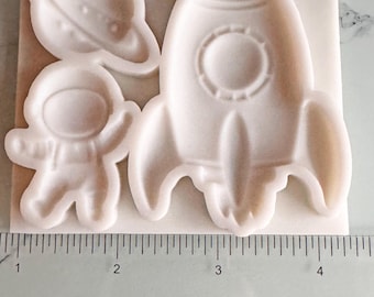 Molde de silicona apto para alimentos con temática espacial: astronauta, cohete, planeta