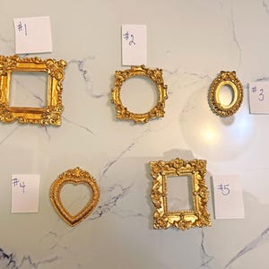 Marcos de fotos acrílicos en miniatura dorados