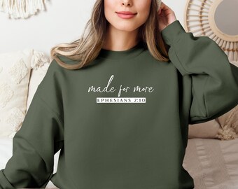 May include: A dark green sweatshirt with the text "made for more" and "EPHESIANS 2:10" in white.