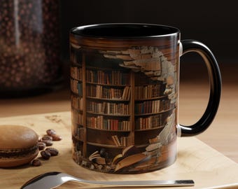 May include: A black-handled coffee mug with a wraparound image of a library bookshelf. The design features a detailed illustration of books, shelves, and a crumbling wall. The mug sits on a wooden surface with a spoon and a macaron.