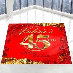 May include: A red banner with gold accents, featuring the text "Valerie's 45th Birthday Celebration." The design includes gold foil, roses, and a large gold number 45. The banner is designed for a birthday celebration.