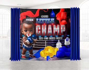 May include: A blue and red boxing themed baby shower backdrop with a cartoon baby wearing boxing gloves and a pacifier. The text reads "Our Little Champ is on his way".
