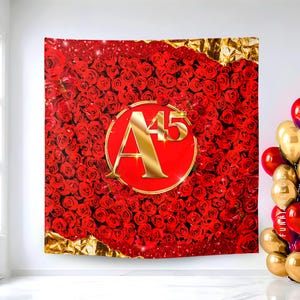 May include: A red tapestry featuring a dense pattern of red roses. A gold-colored circle in the center displays the letter "A" and the number "45" in gold. The tapestry has gold foil accents.