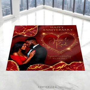 May include: A red and gold anniversary card with a couple in the center. The card says "Happy Anniversary" and "Julie & Karl" with a heart shape around the names. The date "02/14/2017" and the text "8 years, one love, forever to go" are also on the card.