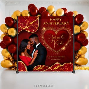 May include: Red and gold anniversary backdrop with a photo of a couple in front of a large heart with the text "Julie & Karl" and the date "02/14/2017". The text "8 years one love, forever to go" is also included.