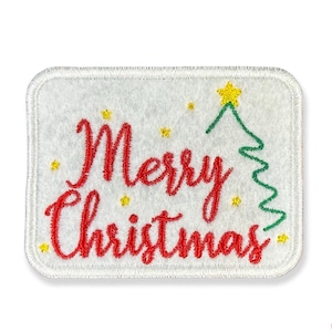 May include: White felt patch with red embroidered text "Merry Christmas" and a green embroidered Christmas tree with a yellow star on top.