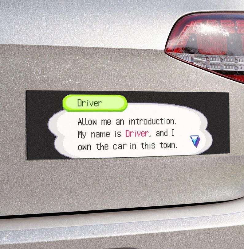 May include: A black rectangular car magnet with the text "Driver" in a green bubble. The magnet has a white speech bubble with the text "Allow me an introduction. My name is Driver, and I own the car in this town."