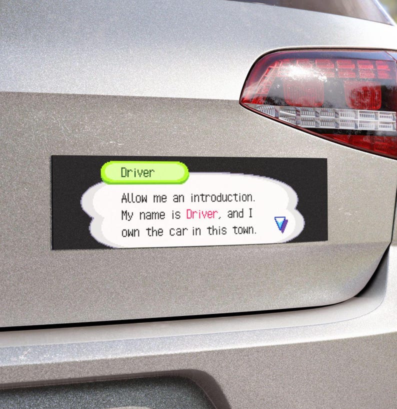 May include: A rectangular car magnet with the text "Driver" in a green bubble. The magnet has a black background and a white speech bubble with the text: "Allow me an introduction. My name is Driver, and I own the car in this town."