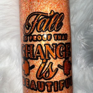 Fall glitter tumbler cup with glitter leaves.