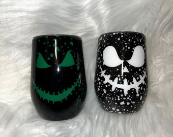 Vaso fluorescente de Halloween con caras espeluznantes y efecto burbuja.