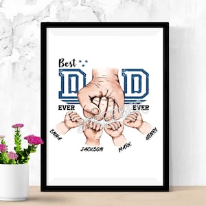 May include: A white framed print with a blue and white graphic of a father's hand holding the hands of four children. The text "Best Dad Ever" is above the graphic and the children's names are below the graphic. The names are Emma, Jackson, Mark, and Henry.
