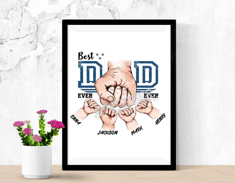 May include: A white framed print with a blue and white graphic of a father's hand holding the hands of four children. The text "Best Dad Ever" is above the graphic and the children's names are below the graphic. The names are Emma, Jackson, Mark, and Henry.