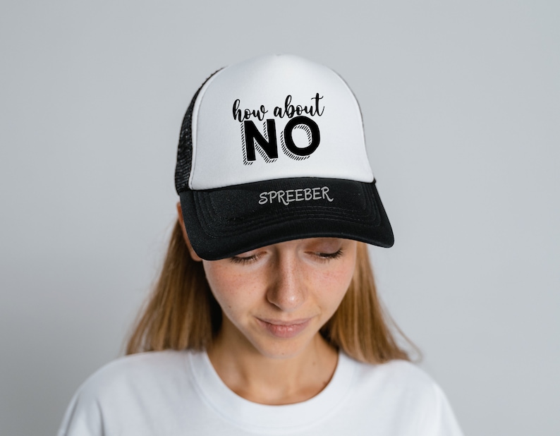 May include: A black and white trucker hat with the text "how about NO" in black lettering. The hat has a black mesh back and a white front.