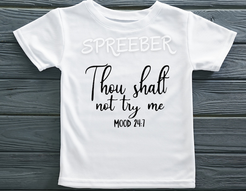 May include: White t-shirt with black text that reads "Thou shalt not try me MOOD 24:7".