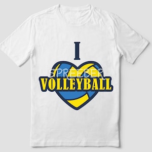 May include: White t-shirt with a blue and yellow heart design. The heart is a volleyball and the text "I love volleyball" is written on the shirt.