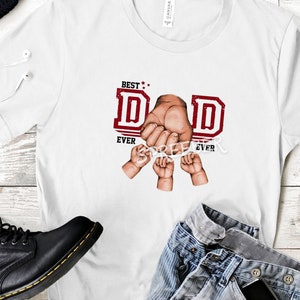 May include: White t-shirt with a red graphic that says "Best Dad Ever" with a hand holding the letters "D" and "A" and three small hands holding the letters "D" and "E".