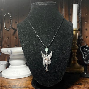 handmade y2k fairy indie black fabric cord necklace with green bead and fairy pendant