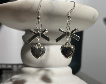 handmade coquette indie silver bow charm and heart fish hook plated dangle earrings