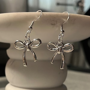 handmade coquette indie silver plated bow charm fish hook plated dangle earrings
