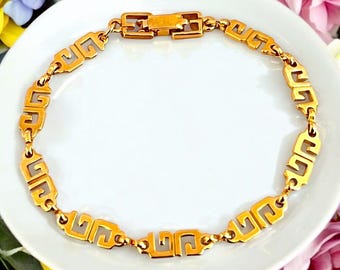 GIVENCHY: Gold Metal 