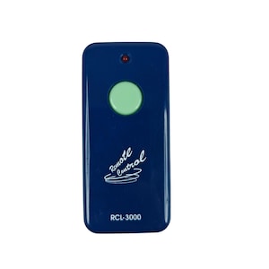 May include: A navy blue remote control with a large, round, light green button in the center. The remote has the words "Remote Control" in a cursive font and the model number "RCL-3000" printed on it.