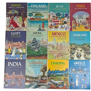 May include: A collection of vintage travel books with colorful covers. Titles include "Nigeria," "Finland," "Iran," "Peru," "Egypt," "Japan," "Mexico," "Thailand," "India," "Canada," "Ethiopia," and "Greece."