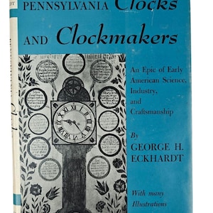 May include: A vintage book titled "Pennsylvania Clocks and Clockmakers" with a blue cover. The cover features a detailed illustration of a clock and circular designs. The text includes "An Epic of Early American Science, Industry, and Craftsmanship."
