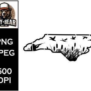 May include: A black and white graphic depicting the outline of North Carolina, with cattails, grass, and birds in flight. The image includes the text "PNG", "JPEG", and "500 DPI". The Lazy Bear Hat Co. logo is also present.