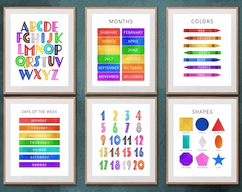 May include: Six colorful educational posters for children. The posters feature the alphabet, months of the year, colors, days of the week, numbers 1-20, and shapes.