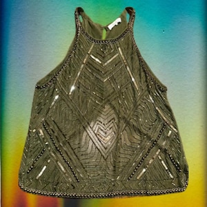 May include: A sleeveless olive green top with a geometric pattern of gold sequins and beads. The top has a halter neckline and a beaded trim.