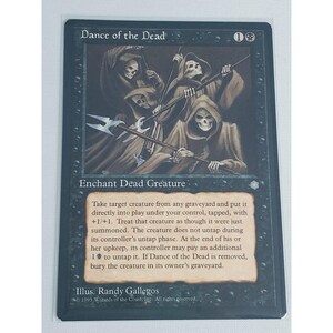 May include: Black Magic: The Gathering card titled "Dance of the Dead." The card features an illustration of skeletal figures in hooded robes with spears. Text includes game instructions and the artist's name.