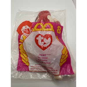 May include: A sealed plastic bag containing a Ty Snort toy animal. The bag is pink and yellow with a Ronald McDonald-like character and the number 8. The toy animal is red and white.