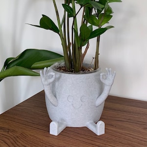 Pot assis à la main OK