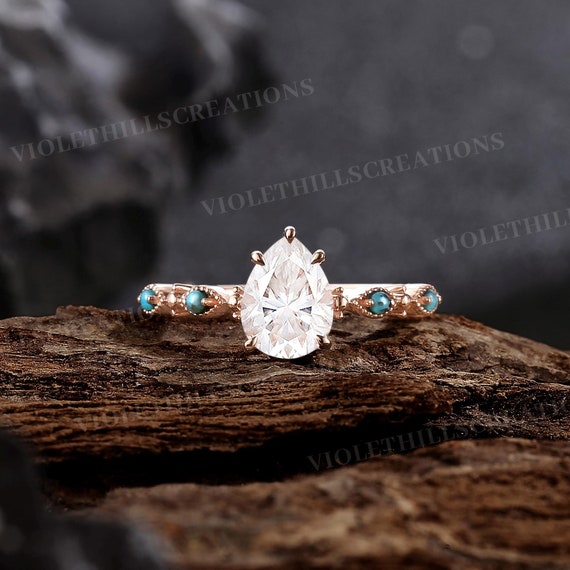 Pear Shaped Diamond Engagement Rings With Turquoise Accents