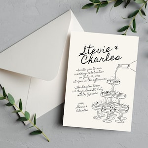 Puede incluir: Una invitación de boda con una ilustración en blanco y negro de copas de champán y una botella vertiendo champán. El texto dice "Stevie & Charles" e incluye la fecha, la hora y el lugar de la boda.