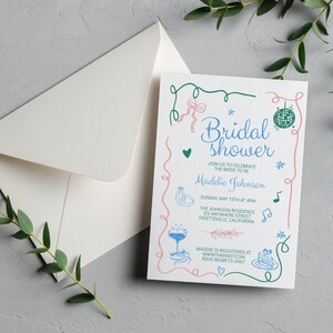 May include: A pink and green illustrated bridal shower invitation with the text "Bridal Shower" and "Maddie Johnson". The invitation includes details about the event, including the date, time, and location. It also includes the text "RSVP, Regrets Only".