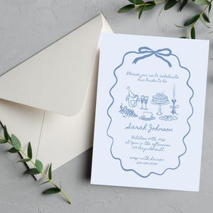 May include: A blue and white bridal shower invitation with a hand-drawn illustration of a champagne bottle, glasses, cake, grapes, and a teacup. The text reads "Please join us to celebrate our bride to be Sarah Johnson October 20th, 2014 at 2pm in the afternoon 123 Anywheresst rvop with Lauren 123-474-3434".