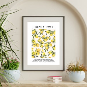 May include: A framed print with a white background and a lemon pattern. The print features the text "JEREMIAH 29:11" and the verse "FOR I KNOW THE PLANS I HAVE FOR YOU, DECLARES THE LORD, PLANS FOR WELFARE AND NOT FOR EVIL, TO GIVE YOU A FUTURE AND A HOPE."
