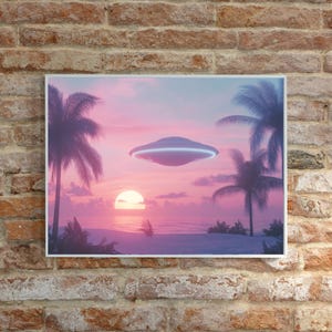 May include: A framed print of a pink and purple sunset over a beach with two palm trees and a flying saucer in the sky.
