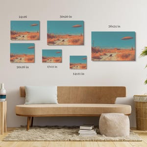 May include: A collection of canvas art prints depicting a desert landscape under a teal sky with a flying saucer. The prints vary in size, including 24x16 inches, 30x20 inches, 36x24 inches, 20x16 inches, 17x11 inches, and 14x11 inches.