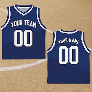 May include: A blue basketball jersey with white trim and white lettering. The front of the jersey says "YOUR TEAM" and has the number "00" on it. The back of the jersey says "YOUR NAME" and has the number "00" on it.