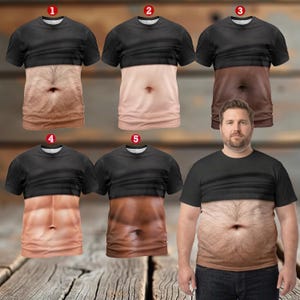 May include: A collection of five short-sleeved t-shirts featuring a black upper section and a realistic photographic print of various human torsos on the lower section, including hairy, smooth, and muscular skin tones, numbered one through five.