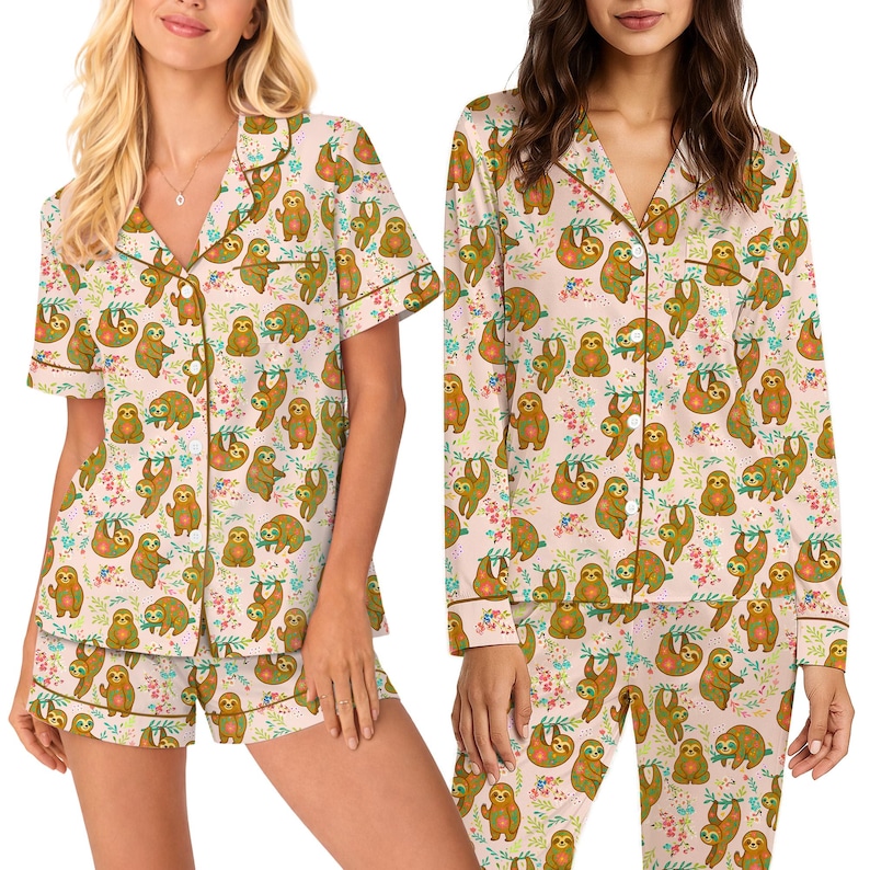 May include: A set of pink pajamas with a repeating pattern of sloths and floral accents. The pajamas include a short-sleeved button-up shirt and shorts. The shirt and shorts have brown trim.