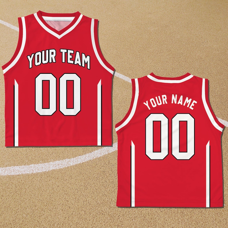 May include: Red basketball jersey with white trim and black accents. The front of the jersey has "YOUR TEAM" and "00" printed in white. The back of the jersey has "YOUR NAME" and "00" printed in white.