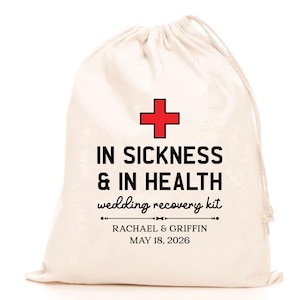 May include: A cream-colored drawstring bag with a red cross and black text that reads "IN SICKNESS & IN HEALTH wedding recovery kit." Below the text are the names "RACHAEL & GRIFFIN" and the date "MAY 18, 2026."