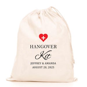 May include: A cream-colored drawstring bag with the words "HANGOVER Kit" printed in black. A red heart with a white cross is above the text. The names "JEFFREY & AMANDA" and the date "AUGUST 20, 2025" are printed below.